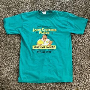 John Carters Place T-Shirt. Size Medium